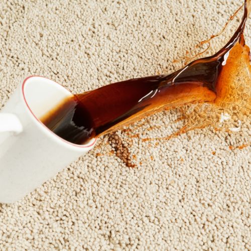 Coffee Spilling from Cup onto Carpet